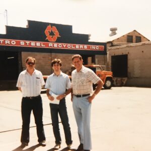 The owner of Metro Recyclers, standing in front of their office.